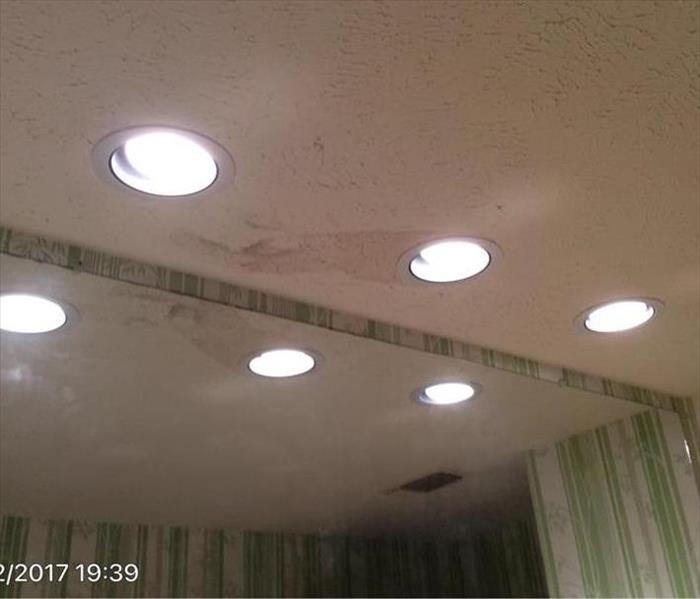 Bathroom ceiling water damage from rain water